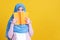 Asian Muslim woman in hijab and wearing medical mask and holding book