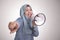 Asian muslim woman Shouting with Megaphone, Leader, Supporter or Protester