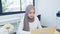 Asian muslim woman using laptop in modern home office. Small business company owner, startup entrepreneur, work at home concept