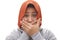 Asian muslim woman wearing hijab closing her mouth with fingers. Worried gesture, can`t say anything. Shocked to hear bad news or