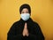 Asian muslim woman wearing hijab and mask during coronavirus covid pandemic new normal, woman wearing face protective mask doing