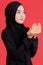 Asian Muslim women wear black hijab. Eyes look to god Doing religious activities, praying Conceptual for religion With  red