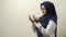 Asian Muslim women wearing hijab praying