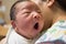 Asian new born baby yawning