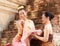 Asian noble beauty with maid dressed in traditional clothes shopping in old retro historical period theme