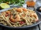 Asian noodles udon with shrimp , spice , on the plate. Closeup. Chinese/Japanese noodles