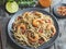 Asian noodles udon with shrimp , spice , on the plate. Closeup. Chinese/Japanese noodles