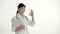 Asian nurse on white background smiles and lifts thumb.