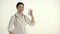 Asian Nurse on White Background Smiles and Lifts Thumb.