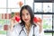 Asian nutritionist doctor woman showing red heart and apple in hand