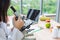 Asian nutritionist doctor woman working microscope and labtop on wooden table