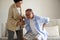Asian old woman helping an elderly man having a back pain, backache at home. Senior healthcare concept