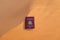 An Asian passport on the hot desert land of Riyadh, Saudi Arabia, Middle East