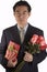 Asian People With Roses And Present