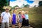 Asian People in Straw Hats Pose on Stone Stairway in Park