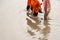 Asian people walking on flooding road during monsoon season