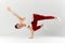 Asian personal break dancer trainer doing handstand on white background