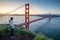 Asian photographer at Golden Gate Bridge
