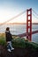 Asian photographer at Golden Gate Bridge