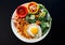 Asian Pineapple Fried rice with fried egg, shrimp,and vegetables on a white plate and black background