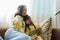 Asian portrait, Grandma and granddaughter doing recreational activities playing tablet computers on the sofa