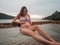 Asian pregnant woman in bikini sitting on hammock in turquoise sea water near beach. tropical beach in Koh Kut Island, Thailand. p