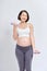 Asian pregnant woman do exercise, standing and lifting dumbbells, sportive pregnancy motherhood concept
