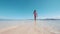 Asian pretty girl walking on sandbar in ocean beach in Manjuyod, Philippines.