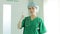 Asian professional female surgeon standing in front of the operating room