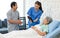 Asian professional successful female assistant internship nurse in blue uniform holding tablet computer visiting discussing