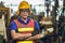 Asian Professional worker standing arm cross in heavy industry working in factory production line process with eyes and ears
