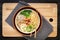 Asian ramen noodle pork bone based soup with pork chashu on cutting board background