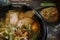 Asian ramen noodles in black bowlTraditional asian soup in black pottery.
