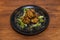 Asian recipe of spiced pork balls in tempura batter with lettuce