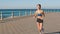 Asian, running and beach with woman in fitness training, body workout and outdoor wellness for summer health, goals and