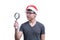 Asian Santa Claus man with eyeglasses and grey shirt has searching something with magnifying glass isolated on white background w
