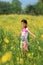 Asian school children or girls are cheerful in the flower beds gardens