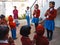 Asian school students praying at open area courtyard in india January 2020