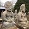 Asian sculptures stone idols, mythical gods, close-up