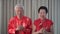 Asian senior couple greeting for Chiense New Year