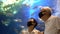 Asian senior couple new normal dating at aquarium tunnel beautiful underwater feel