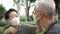 Asian senior elder couple wearing masks and concern about covid pandemic together