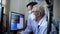 Asian senior elder doctors wearing mask looking at computer screen diagnose patient data and information