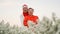 Asian senior elderly couple celebrating Christmas holiday season white flower and red winter sweater positive happiness emotion