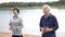 Asian Senior Elderly couple Practice Taichi, Qi Gong exercise ne