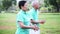 Asian Senior Elderly couple Practice Taichi, Qi Gong exercise outdoor in the park. Abstract love and nature