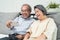 Asian senior elderly couple use phone remote video call with family. Happy Older grandparent holding smartphone, enjoy talk