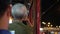 Asian senior elderly man sitting in running Hong Kong tram thinking about problems and future