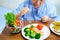 Asian senior or elderly old lady woman patient eating breakfast healthy food with hope and happy while sitting and hungry on bed i