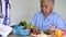 Asian senior or elderly old lady woman patient eating Salmon steak breakfast with vegetable healthy food